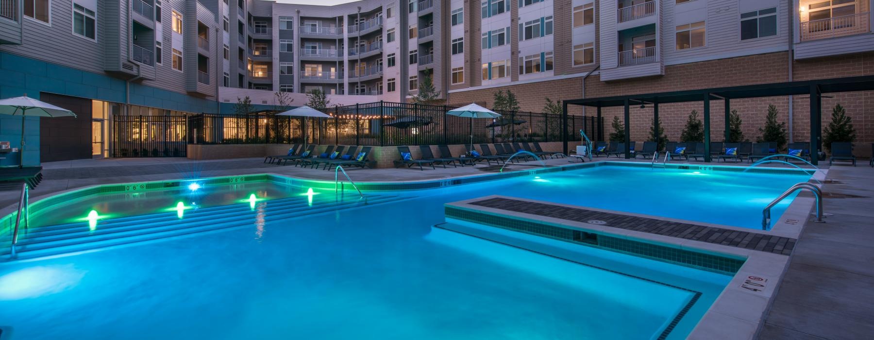 a swimming pool in front of a building