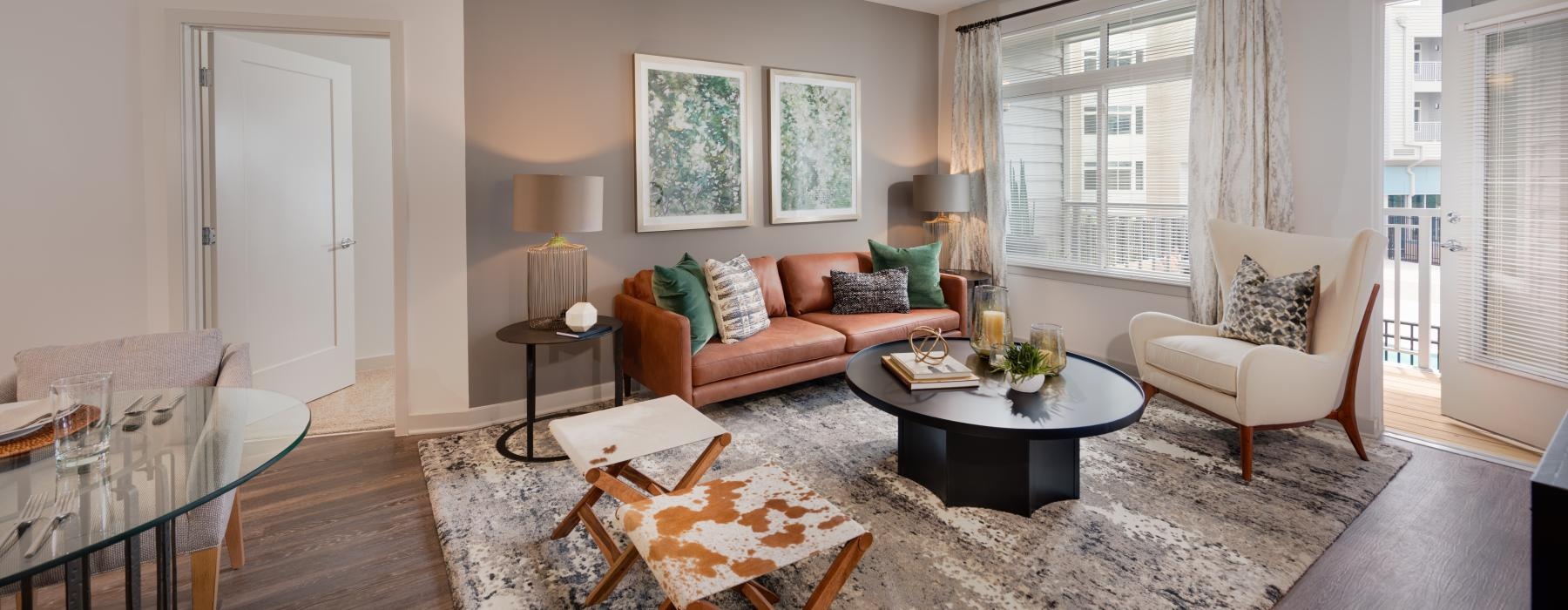 a living room with a rug and a coffee table