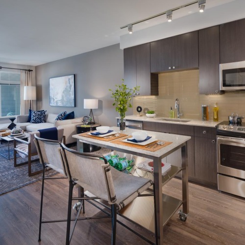 a kitchen with a table and chairs