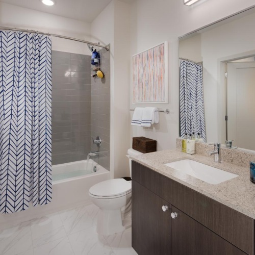 a bathroom with a tub sink and toilet