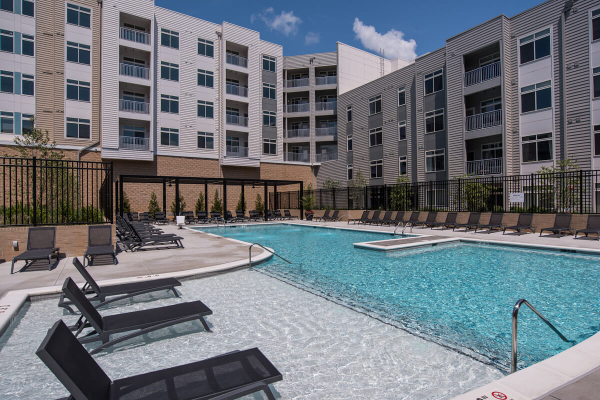 Rockville Apartments - The Daley at Shady Grove Apartments Swimming Pool With Poolside Seating